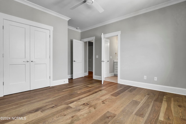 unfurnished bedroom with a closet, ceiling fan, wood-type flooring, and ornamental molding