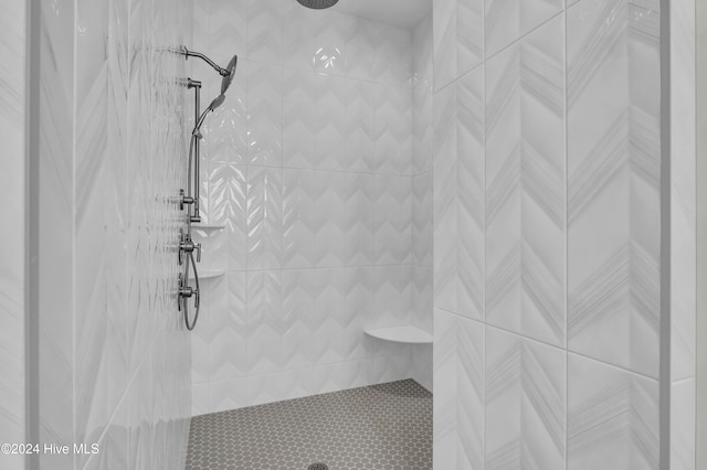 bathroom with a tile shower