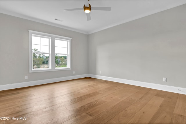 unfurnished room with ceiling fan, crown molding, and light hardwood / wood-style flooring