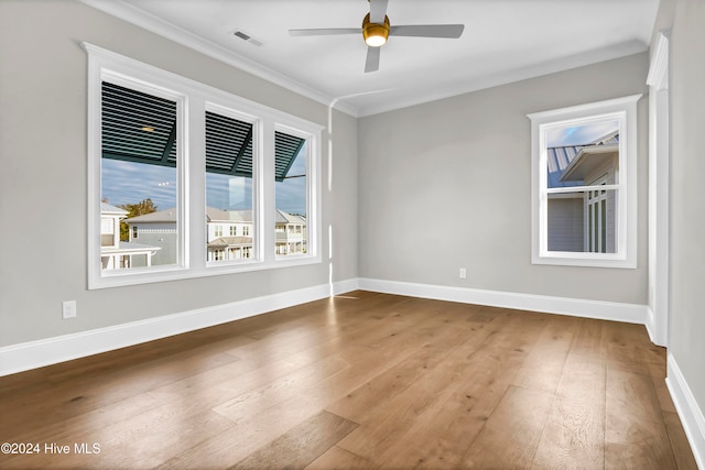 unfurnished room with crown molding, hardwood / wood-style flooring, and ceiling fan