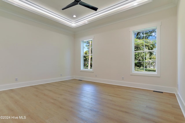 bedroom with ceiling fan, multiple windows, light wood-type flooring, and crown molding