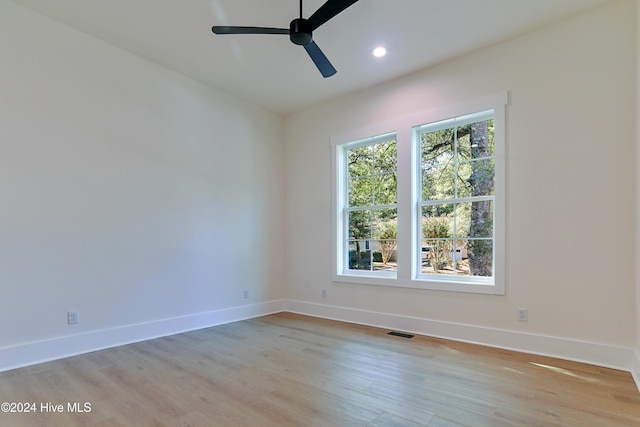 bedroom with light hardwood / wood-style floors and ceiling fan