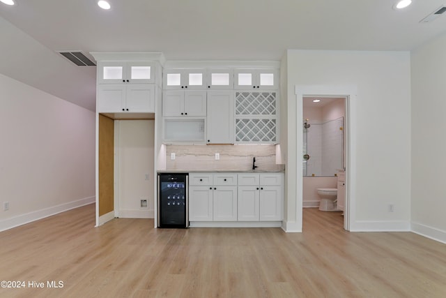 bathroom with toilet, vanity, wood-type flooring, and walk in shower