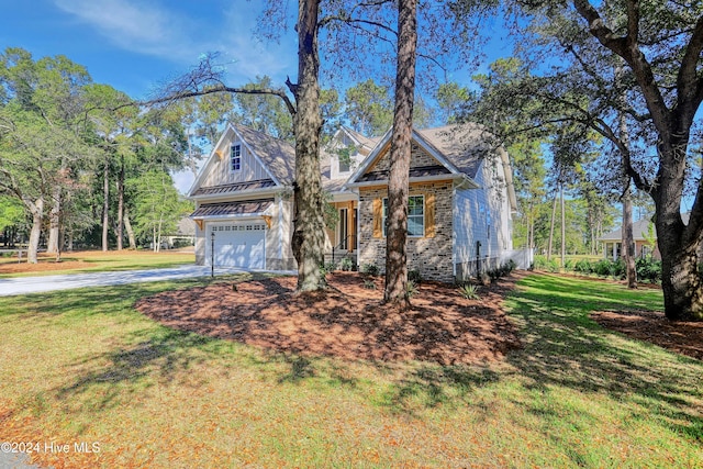 craftsman-style home with a garage and a front yard