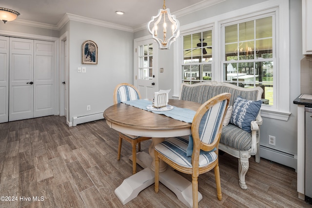 dining room with hardwood / wood-style flooring, ornamental molding, and a baseboard radiator