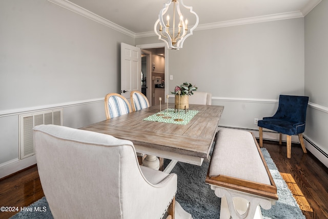 dining space featuring an inviting chandelier, ornamental molding, and dark wood-type flooring