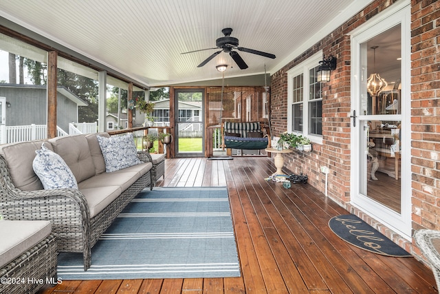 wooden terrace with an outdoor hangout area and ceiling fan