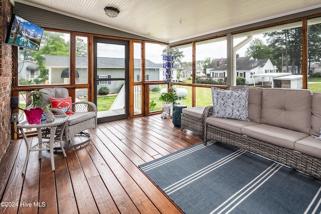 sunroom / solarium with vaulted ceiling