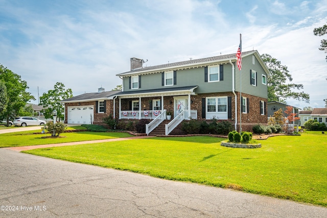 view of front of house featuring a porch, a front lawn, and a garage