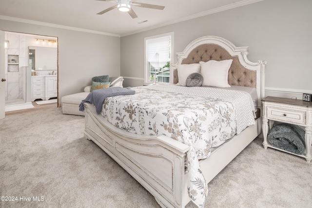 bedroom featuring light carpet, crown molding, ensuite bathroom, and ceiling fan