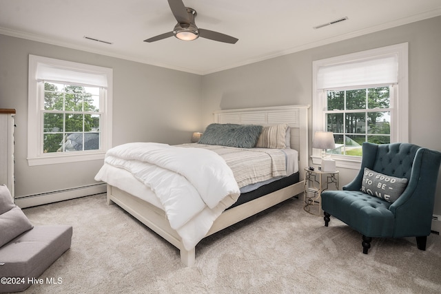 bedroom featuring light carpet, multiple windows, a baseboard radiator, and ceiling fan