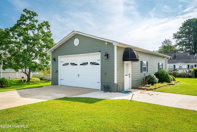 garage featuring a yard