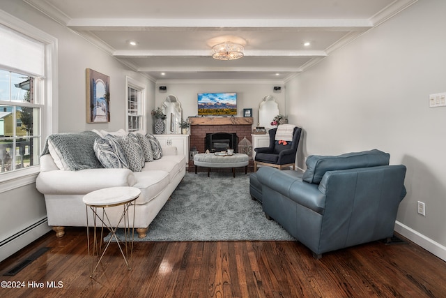 living room featuring baseboard heating, beamed ceiling, a brick fireplace, and dark hardwood / wood-style floors