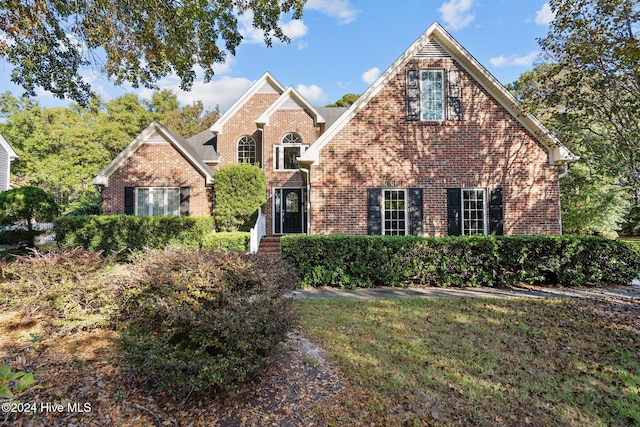 front facade with a front lawn