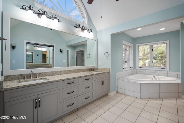 bathroom featuring ceiling fan, vaulted ceiling, vanity, plus walk in shower, and tile patterned floors