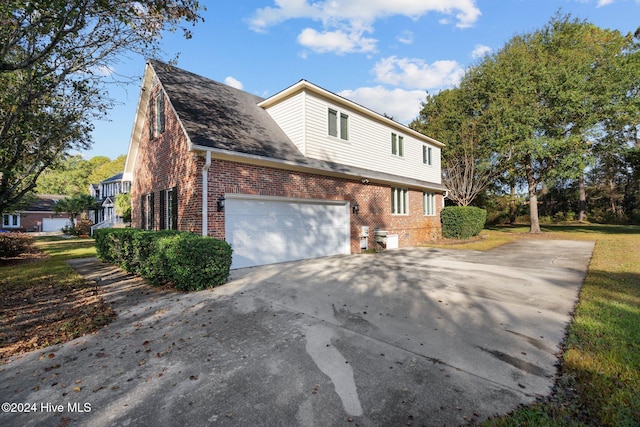 view of property exterior with a garage