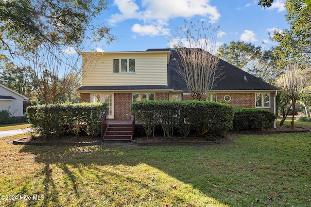 view of front property with a front yard and a deck