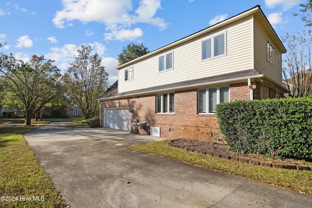 view of side of home featuring a garage