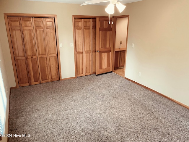 unfurnished bedroom with ceiling fan and light colored carpet