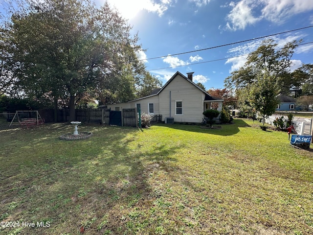 view of yard with central AC