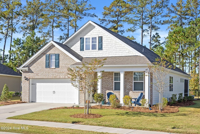 view of front of property with a garage and a front lawn