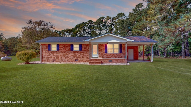 ranch-style house with a lawn