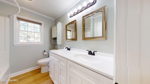 full bathroom featuring tub / shower combination, crown molding, toilet, vanity, and hardwood / wood-style flooring