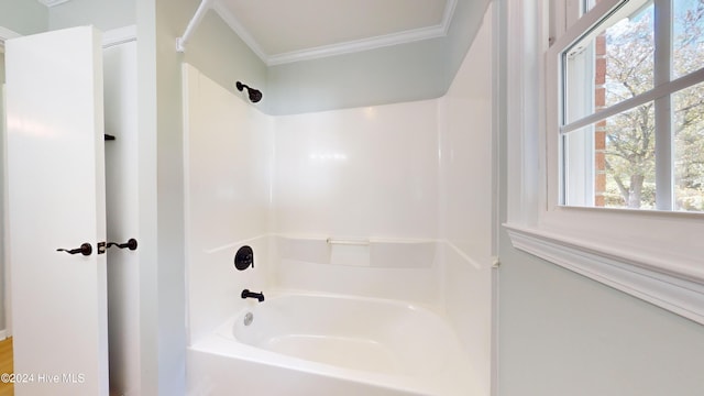 bathroom with a healthy amount of sunlight and ornamental molding