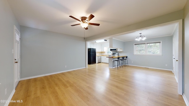 unfurnished living room with crown molding, light hardwood / wood-style floors, and ceiling fan with notable chandelier