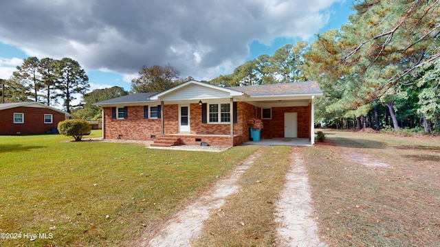 single story home with covered porch, a front yard, and a carport