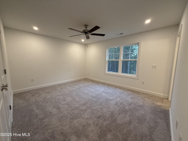 unfurnished room with carpet floors and ceiling fan