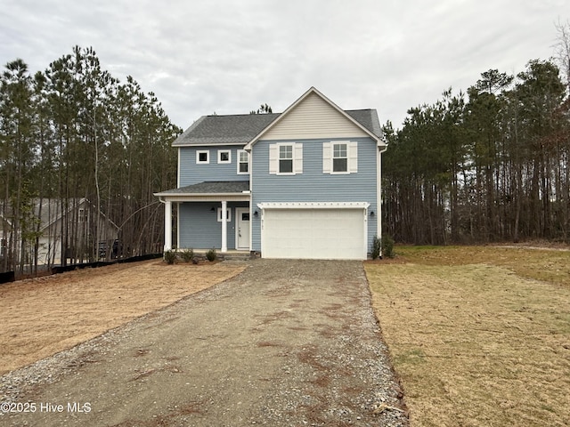 view of front property with a front yard and a garage