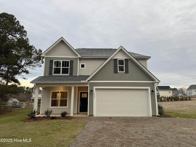 view of front facade with a front yard and a garage