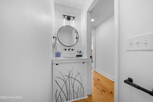 bathroom featuring hardwood / wood-style floors and vanity