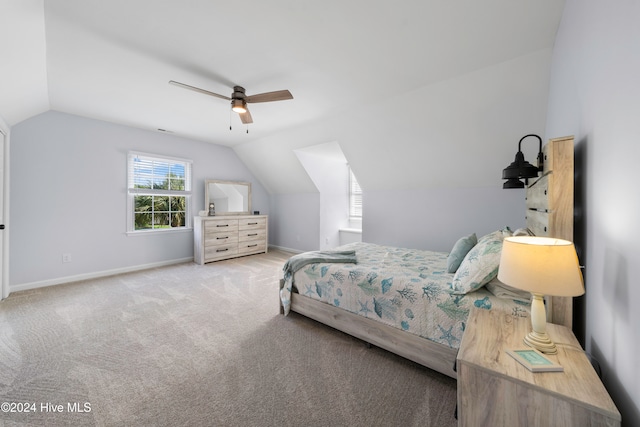 carpeted bedroom featuring ceiling fan and lofted ceiling