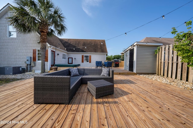 wooden terrace with outdoor lounge area and central AC