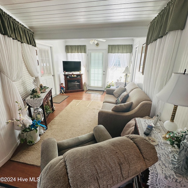 living room with wood ceiling and light wood-type flooring