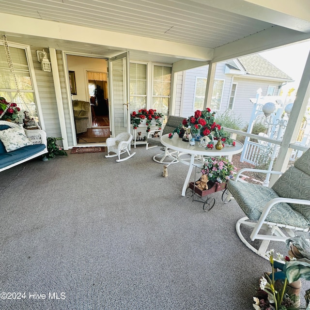 sunroom with beamed ceiling