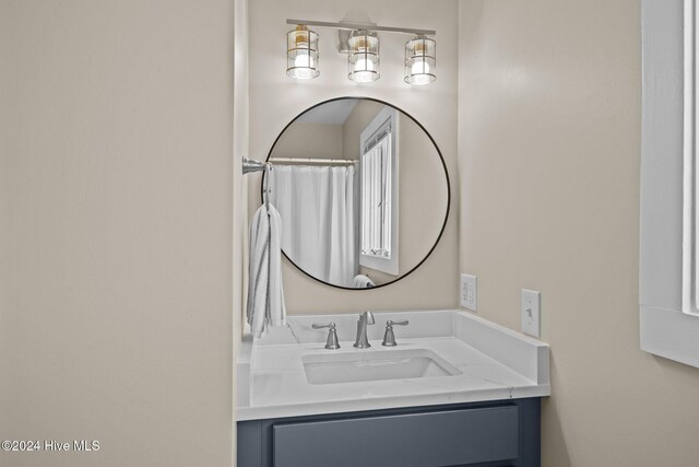 full bathroom featuring vanity