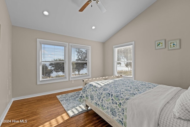 bedroom featuring lofted ceiling, recessed lighting, baseboards, and wood finished floors