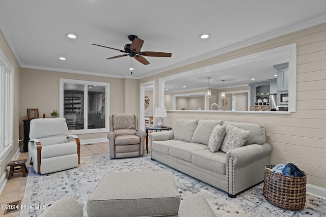 tiled living room with crown molding and ceiling fan