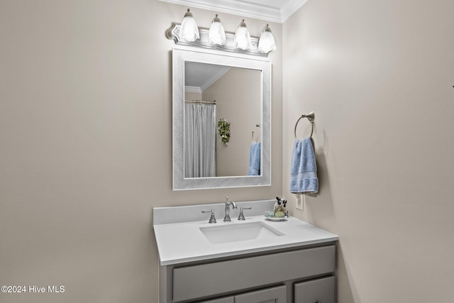 bathroom with vanity and ornamental molding