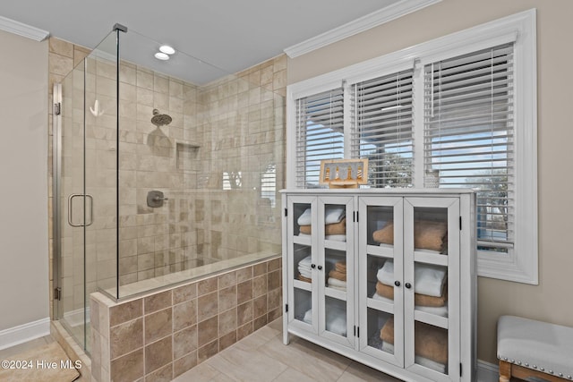 bathroom with an enclosed shower, tile patterned flooring, and crown molding