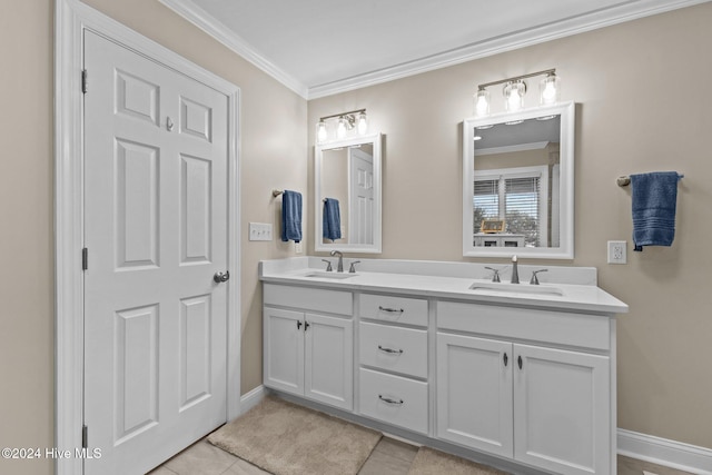 bathroom with vanity, ornamental molding, and tile patterned flooring