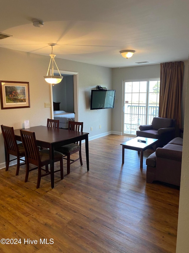 dining area featuring dark hardwood / wood-style floors