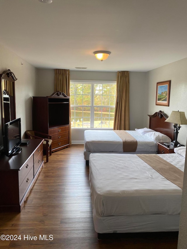 bedroom featuring wood-type flooring