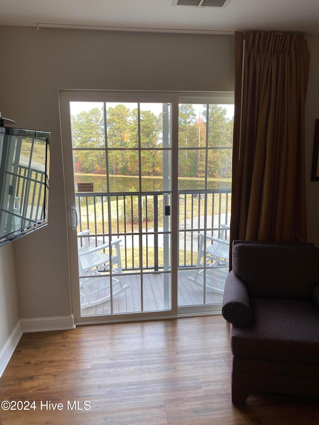 doorway to outside with hardwood / wood-style flooring