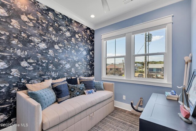 living room featuring a ceiling fan, wood finished floors, and baseboards