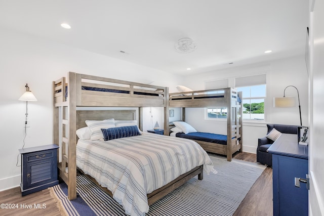 bedroom featuring recessed lighting, baseboards, and wood finished floors