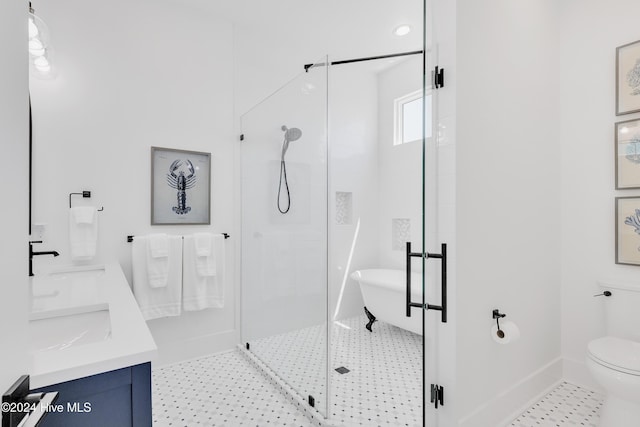 full bathroom with baseboards, double vanity, tile patterned flooring, a shower stall, and toilet